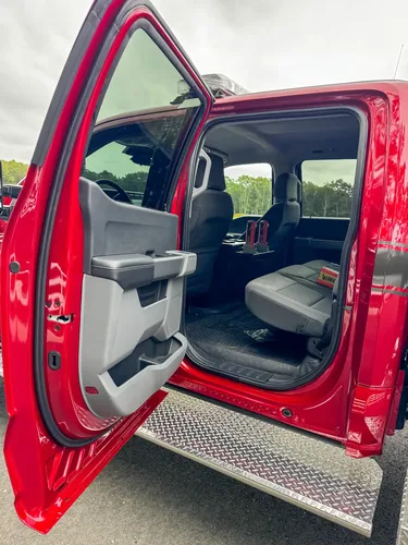 Rear cabin view toward front seats showing center console and seatback spacing.